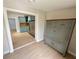 View of dining area with wood floors and painted furniture, transitioning to the kitchen at 4218 S Lockwood Ridge Rd, Sarasota, FL 34231
