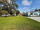 Charming home featuring a well-maintained front yard with lush green grass and a patterned driveway at 4218 S Lockwood Ridge Rd, Sarasota, FL 34231