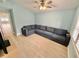 Comfortable living room with a large sectional sofa and stylish ceiling fan at 4218 S Lockwood Ridge Rd, Sarasota, FL 34231
