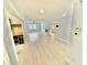 Bright living room featuring tile flooring, a white brick fireplace, and a view into other rooms at 4218 S Lockwood Ridge Rd, Sarasota, FL 34231