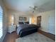 Comfortable bedroom showcases a well-made bed, complemented by end tables and decorative wall art at 4224 Hall St, Port Charlotte, FL 33948