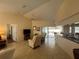Bright living area seamlessly connects to the kitchen and offers access to the outdoor pool area at 4224 Hall St, Port Charlotte, FL 33948