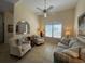 Cozy living room with a large window, comfortable seating, and tasteful decor creates an inviting atmosphere at 4224 Hall St, Port Charlotte, FL 33948