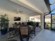Outdoor dining area with a fan overhead creates a comfortable space for enjoying meals outside at 4224 Hall St, Port Charlotte, FL 33948