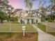 Beautiful home with a well-maintained lawn and white picket fence and mailbox, offering classic curb appeal at 425 Bristol Ct, Sarasota, FL 34237