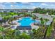 Aerial view of the community pool, clubhouse, and surrounding homes and landscaping at 4411 Hearthstone Run, Palmetto, FL 34221