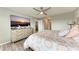 Comfortable bedroom highlighting a TV, dresser, and view into another room at 4411 Hearthstone Run, Palmetto, FL 34221