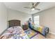bedroom with two twin beds, ceiling fan, and themed decor at 4411 Hearthstone Run, Palmetto, FL 34221