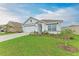 Charming single-story home featuring a manicured lawn and a two-car garage at 4411 Hearthstone Run, Palmetto, FL 34221