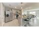 Well-equipped kitchen with stainless steel appliances, granite countertops and seating at bar at 4411 Hearthstone Run, Palmetto, FL 34221