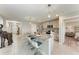 Spacious kitchen island with granite countertops, pendant lighting, and modern bar stool seating at 4411 Hearthstone Run, Palmetto, FL 34221