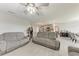Open-concept living room, showing kitchen and dining area with comfortable seating at 4411 Hearthstone Run, Palmetto, FL 34221