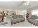 Open-concept living room features tile floors, recessed lighting and leads to the kitchen and dining area at 4411 Hearthstone Run, Palmetto, FL 34221