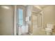 Bright bathroom with shower and tub combination, a window, and a toilet at 462 Island Cir, Sarasota, FL 34242