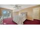 Cozy bedroom with a bed, sliding glass doors to a balcony, and a view of the exterior at 462 Island Cir, Sarasota, FL 34242