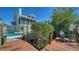 Dockside view featuring pool, beach access, and relaxing waterfront atmosphere at 462 Island Cir, Sarasota, FL 34242