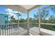 Enjoy the outdoors bug-free on this screened porch with beautiful views of the surrounding neighborhood at 462 Island Cir, Sarasota, FL 34242