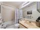 Bathroom with a shower and tub combination, a large mirror, and neutral-colored walls at 4655 46Th Street W Ct # 201, Bradenton, FL 34210