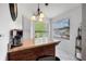 Kitchen featuring a marble countertop, wooden cabinets, and stainless appliances by a bright window at 4655 46Th Street W Ct # 201, Bradenton, FL 34210