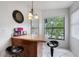 Cozy kitchen with breakfast bar seating, a window view, granite countertops, and modern appliances at 4655 46Th Street W Ct # 201, Bradenton, FL 34210