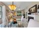 Bright living room featuring a fireplace, ceiling fan, and seamless access to an outdoor balcony at 4655 46Th Street W Ct # 201, Bradenton, FL 34210