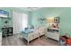 Charming ' bedroom with bright walls, a fan, and cheerful decor that creates a playful atmosphere at 5003 88Th E St, Bradenton, FL 34211