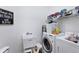 Well-equipped laundry room featuring a utility sink and modern appliances for efficient home chores at 5003 88Th E St, Bradenton, FL 34211