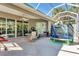 Covered patio with outdoor furniture and play equipment, perfect for relaxation and Gathering fun at 5003 88Th E St, Bradenton, FL 34211