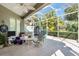 Relaxing screened patio with ceiling fan and view of the back yard at 5003 88Th E St, Bradenton, FL 34211