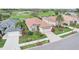 Aerial view of the property with lush greenery and a golf course community at 5105 Pine Shadow Ln, North Port, FL 34287