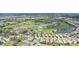 Wide aerial view of community and golf course at 5105 Pine Shadow Ln, North Port, FL 34287