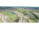 Beautiful aerial shot showcasing a golf course community with ponds and well-maintained landscaping at 5105 Pine Shadow Ln, North Port, FL 34287