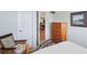 Comfortable bedroom featuring a double bed and a view into another room at 5105 Pine Shadow Ln, North Port, FL 34287