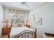 Cozy bedroom with a queen bed, side tables with lamps, and a window overlooking the outdoors at 5105 Pine Shadow Ln, North Port, FL 34287