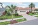 Well-maintained single-story home with a tile roof and verdant landscaping at 5105 Pine Shadow Ln, North Port, FL 34287