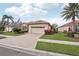 Lovely single Gathering home features a brick driveway and well manicured landscaping at 5105 Pine Shadow Ln, North Port, FL 34287