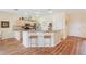 Open concept kitchen with granite countertops and bar stool seating at 5105 Pine Shadow Ln, North Port, FL 34287