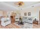 Bright and airy living room with hardwood floors and neutral decor at 5105 Pine Shadow Ln, North Port, FL 34287