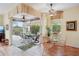 Bright sun room with access to lanai with an outdoor table and ceiling fans at 5105 Pine Shadow Ln, North Port, FL 34287