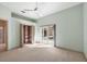 Bedroom featuring sliding glass doors to the pool, a ceiling fan, and bi-fold closet doors at 5416 Ashley Pkwy, Sarasota, FL 34241