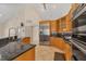 Spacious kitchen with stainless steel appliances and black granite countertops at 5416 Ashley Pkwy, Sarasota, FL 34241