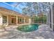 Inviting screened-in pool and spa area with access to the home, perfect for relaxation and outdoor enjoyment at 5416 Ashley Pkwy, Sarasota, FL 34241