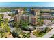 An aerial view of the community buildings and well-maintained roads lined with lush landscaping at 5591 Cannes Cir # 403, Sarasota, FL 34231