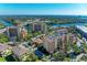 Breathtaking aerial view showcases the complex's waterfront location with stunning views of the river at 5591 Cannes Cir # 403, Sarasota, FL 34231