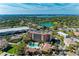 Enjoy stunning aerial view of resort-style condos with a pool and a picturesque lake at 5591 Cannes Cir # 403, Sarasota, FL 34231
