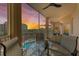 Scenic balcony view overlooking the community pool and a vibrant sunset at 5591 Cannes Cir # 403, Sarasota, FL 34231