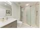 Bathroom featuring a sleek vanity and a frameless glass shower at 5591 Cannes Cir # 403, Sarasota, FL 34231