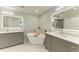 Luxurious bathroom featuring double vanities, and a free-standing tub at 5591 Cannes Cir # 403, Sarasota, FL 34231