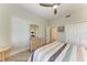 Bright bedroom with ceiling fan and ensuite access at 5591 Cannes Cir # 403, Sarasota, FL 34231