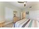 Comfortable bedroom featuring a ceiling fan, wicker furniture, and calming colors for a relaxing atmosphere at 5591 Cannes Cir # 403, Sarasota, FL 34231